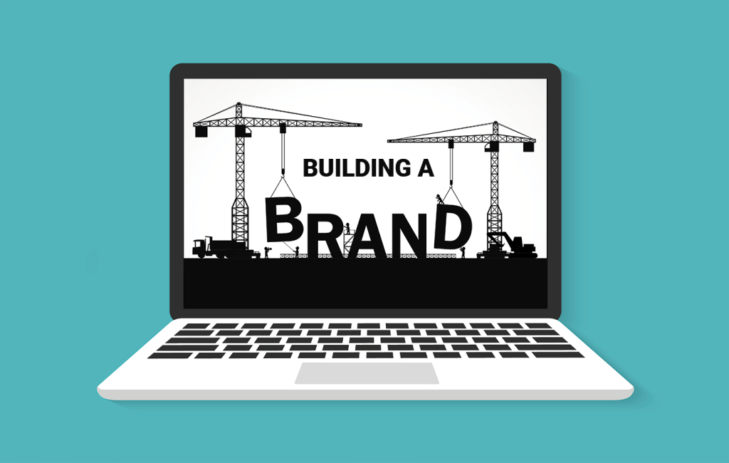 Illustration of laptop with building a brand concept on screen