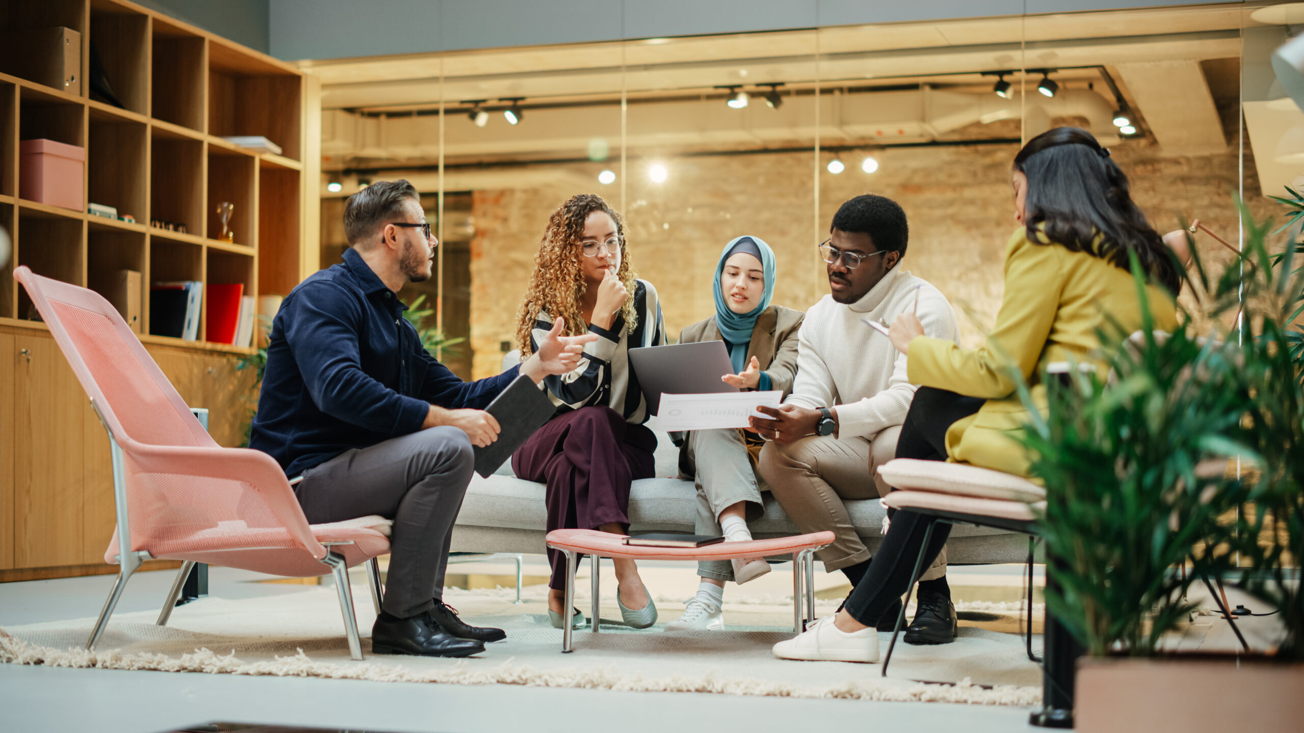 Multiethnic Group of Creative People Working on Project in a Mod Multiethnic Group of Creative People Working on Project in a Mod