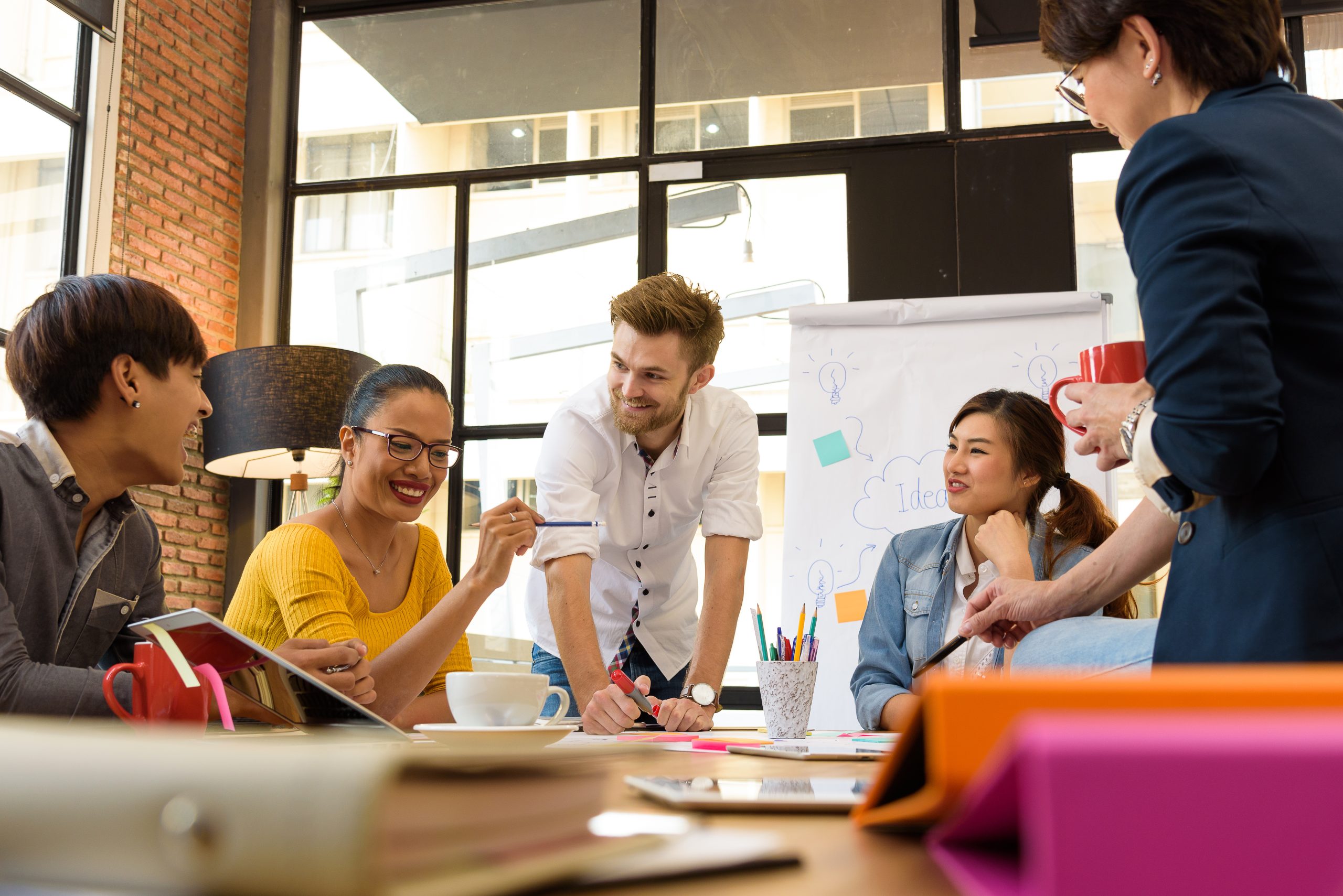 Multi ethnic business person group in casual suit discuss about internal meeting project in modern office. Project and Business concept. Multi ethnic business person group in casual suit discuss about internal meeting project in modern office. Project and Business concept.