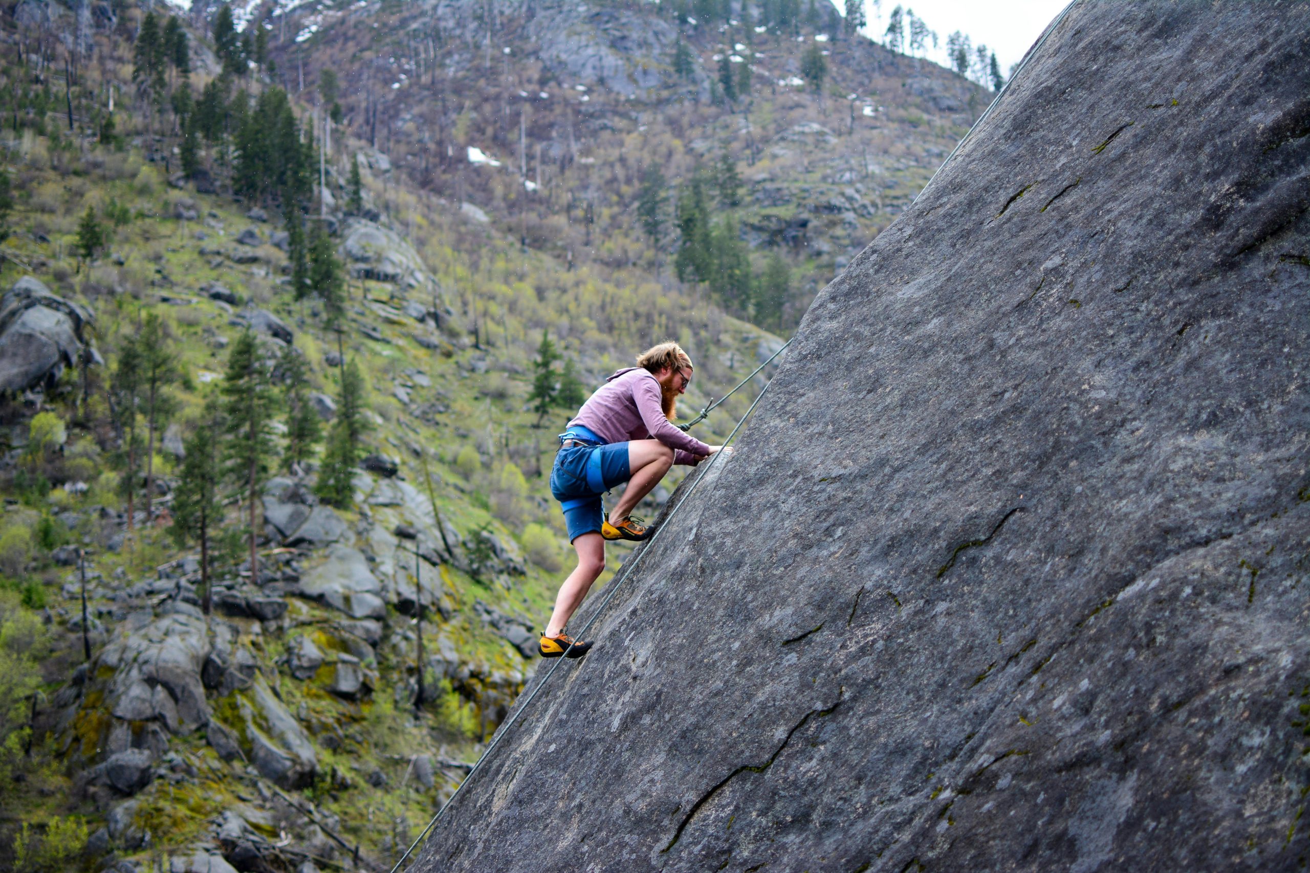 pexels-martin-138963-449609 man climbing a rock
