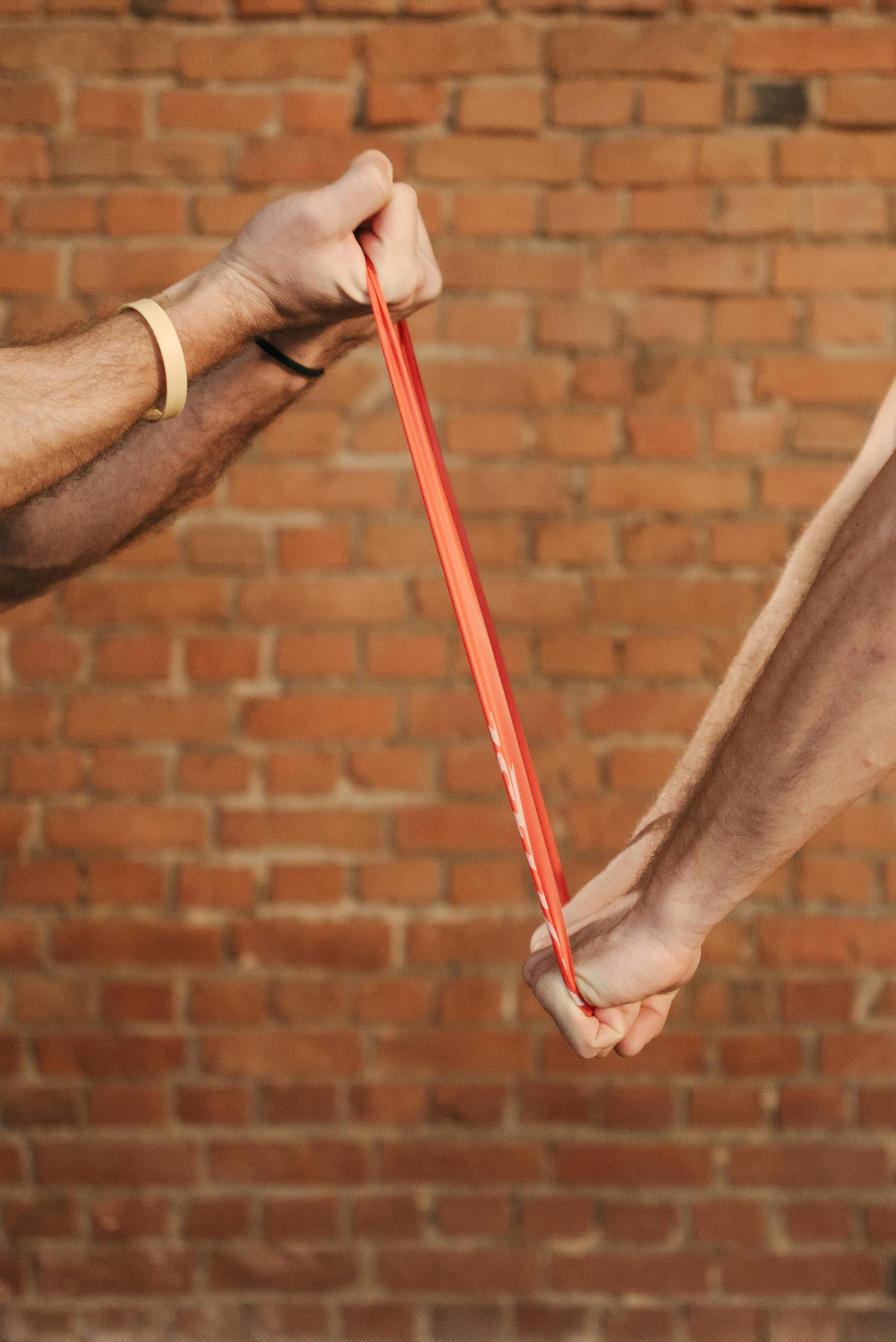 two people pulling on resistance band