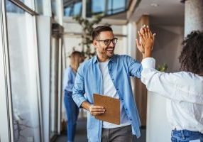Colleagues High-Fiving for Successful Business Collaboration