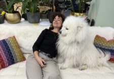 employee hugging dog