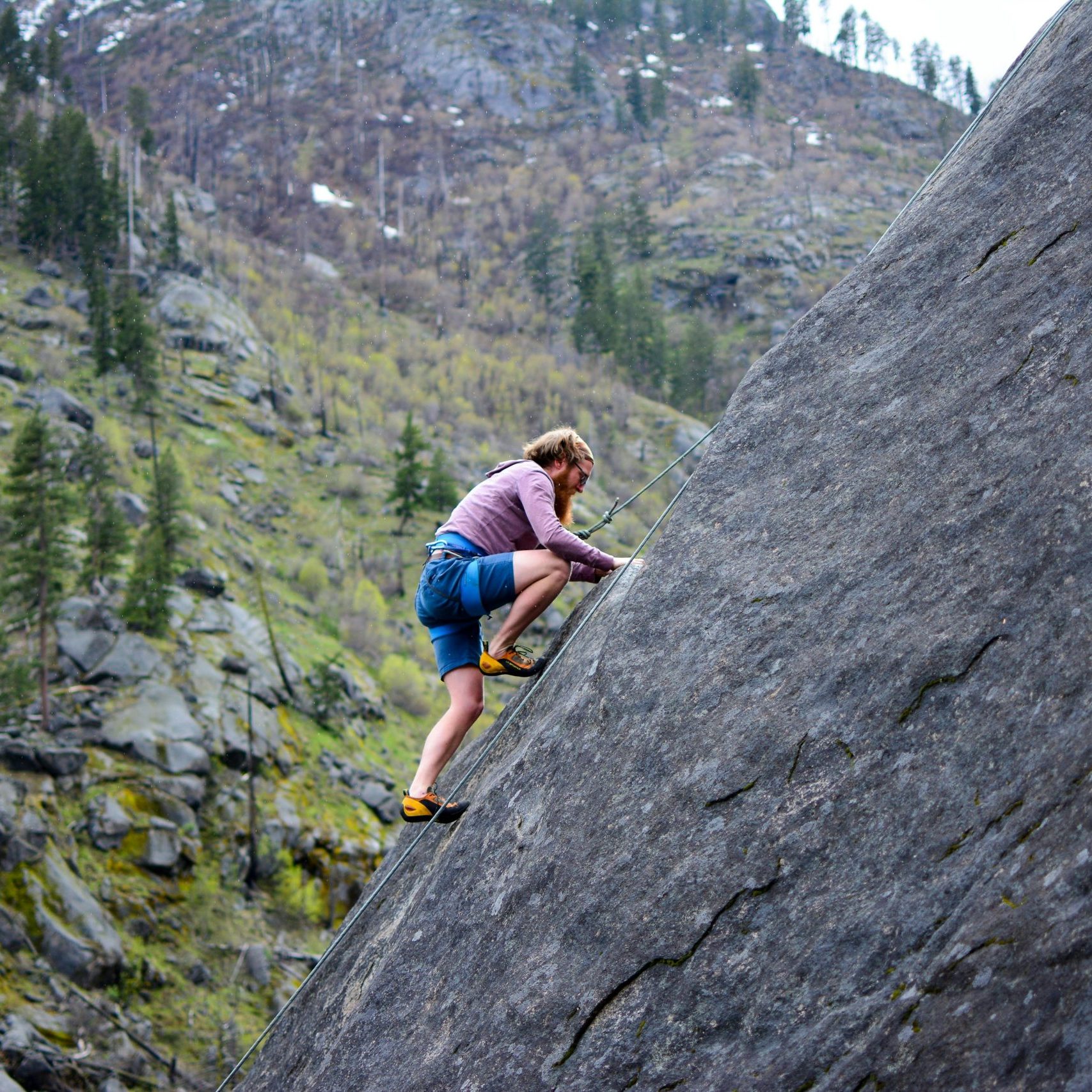 pexels-martin-138963-449609 man climbing a rock