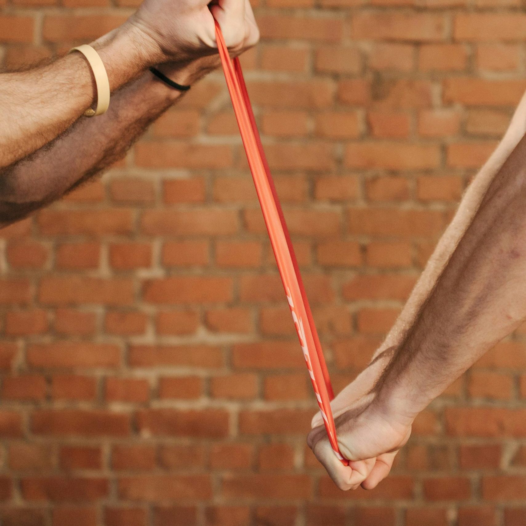 two people pulling on resistance band